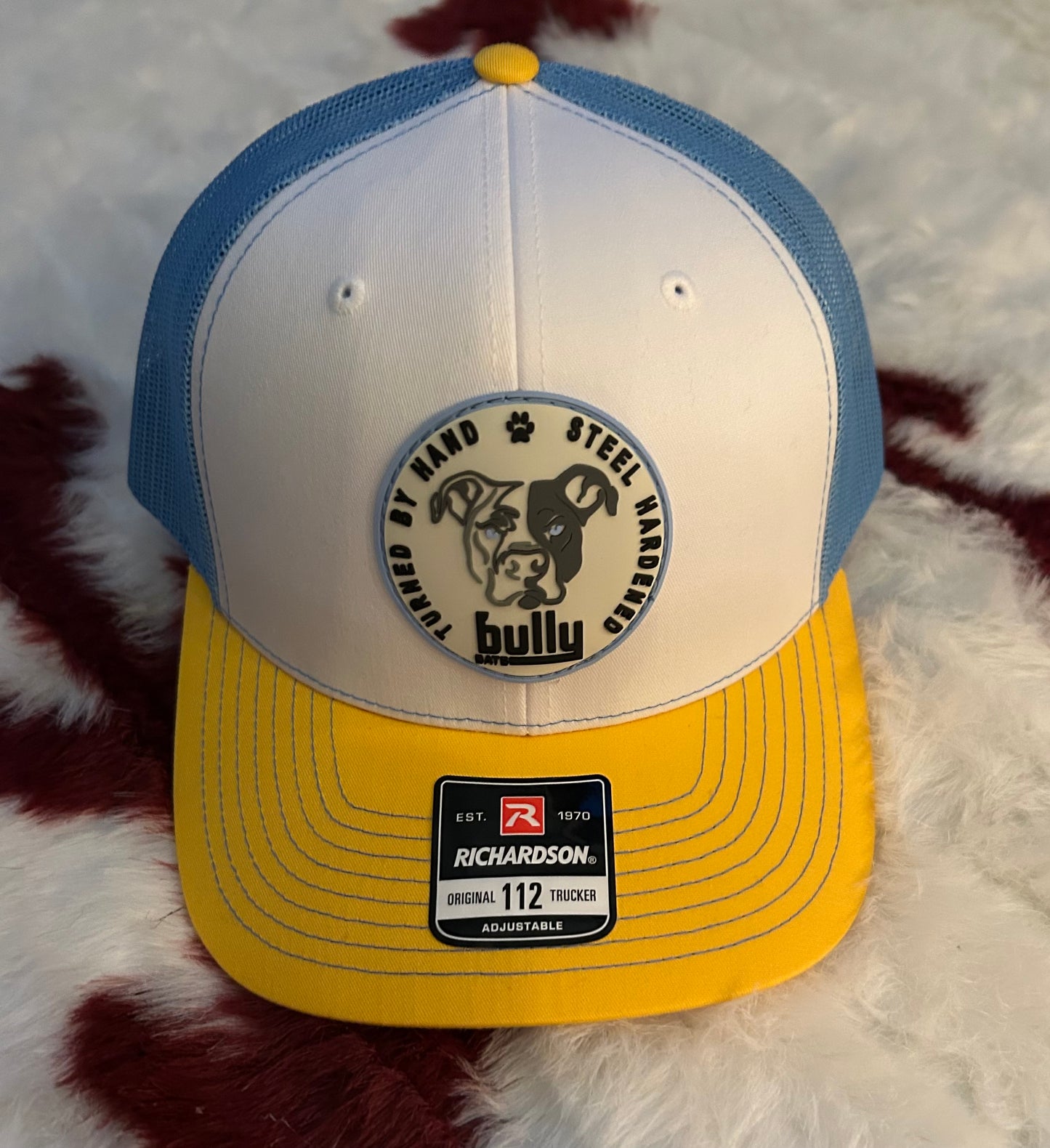 Blue, Yellow, White Snapback Trucker w/Patch